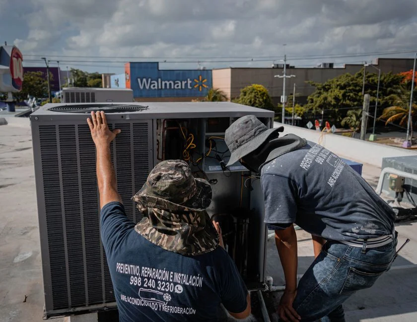 HVAC technician working on air conditioner in Cape Town